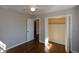 Spacious bedroom with hardwood floors and built-in closet at 9935 La View Cir, Roswell, GA 30075