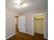 Spacious bedroom with hardwood floors and built-in closet at 9935 La View Cir, Roswell, GA 30075