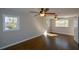 Spacious bedroom featuring hardwood floors and two windows at 9935 La View Cir, Roswell, GA 30075