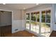 Bright dining area with hardwood floors and view to backyard at 9935 La View Cir, Roswell, GA 30075