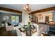 Bright dining room with a glass-top table and hardwood floors at 9935 La View Cir, Roswell, GA 30075