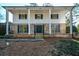 Brick home with a covered front porch and columns at 9935 La View Cir, Roswell, GA 30075