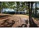 Two-story home nestled amongst mature trees on a spacious lot at 9935 La View Cir, Roswell, GA 30075