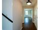 Hardwood floor hallway with view into living room at 9935 La View Cir, Roswell, GA 30075