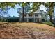 Two-story home with a classic design and a manicured lawn at 9935 La View Cir, Roswell, GA 30075