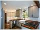 Updated kitchen with white subway tile and farmhouse sink at 9935 La View Cir, Roswell, GA 30075