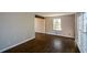 Spacious living room featuring hardwood floors and large windows at 9935 La View Cir, Roswell, GA 30075