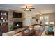 Cozy living room featuring a brick fireplace and adjacent dining area at 9935 La View Cir, Roswell, GA 30075