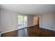 Bright living room featuring hardwood floors and large windows at 9935 La View Cir, Roswell, GA 30075