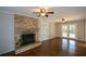 Living room with hardwood floors, fireplace and French doors at 9935 La View Cir, Roswell, GA 30075