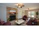 Cozy living room with a brick fireplace and hardwood floors at 9935 La View Cir, Roswell, GA 30075