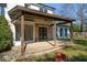 Covered patio with brick flooring and ceiling fan at 9935 La View Cir, Roswell, GA 30075