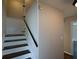 Staircase with dark wood steps and white risers at 9935 La View Cir, Roswell, GA 30075