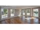 Sunroom with hardwood floors and multiple windows at 9935 La View Cir, Roswell, GA 30075