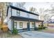 Two-story house with white siding, gray accents, and a covered porch at 1506 Avon Sw Ave, Atlanta, GA 30311