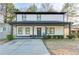 Two-story house with white siding, gray accents, and a covered porch at 1506 Avon Sw Ave, Atlanta, GA 30311