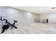 Basement gym with an exercise bike and gray paneled walls at 1506 Avon Sw Ave, Atlanta, GA 30311