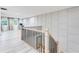 Upper hallway with light hardwood floors and modern staircase at 1506 Avon Sw Ave, Atlanta, GA 30311