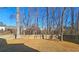 Fenced backyard with mature trees at 6108 Waterton Dr, Lithonia, GA 30058