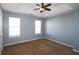 Bright bedroom with neutral walls and carpet at 6108 Waterton Dr, Lithonia, GA 30058