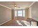 Well-lit bedroom featuring bay window and carpet at 6108 Waterton Dr, Lithonia, GA 30058