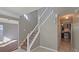 View of stairs and kitchen from entryway at 6108 Waterton Dr, Lithonia, GA 30058