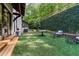 Backyard with artificial turf, stone path and seating at 6305 River Chase Cir, Atlanta, GA 30328