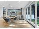 Modern dining area with round table, gray chairs, and view of living room at 6305 River Chase Cir, Atlanta, GA 30328