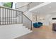 Bright and airy entryway with hardwood floors, a modern staircase, and comfortable seating at 6305 River Chase Cir, Atlanta, GA 30328