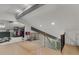 Upper hallway with hardwood floors, open shelving, and a modern staircase at 6305 River Chase Cir, Atlanta, GA 30328