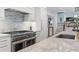 Gourmet kitchen with marble countertops and high-end stainless steel appliances at 6305 River Chase Cir, Atlanta, GA 30328