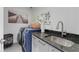 Laundry room with dark countertop and modern appliances at 6305 River Chase Cir, Atlanta, GA 30328