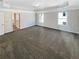 Main bedroom with carpeting and ensuite bathroom at 7227 Parks Trl, Fairburn, GA 30213