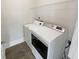 Laundry room with washer, dryer, and overhead shelving at 7227 Parks Trl, Fairburn, GA 30213