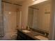 Clean bathroom with double vanity, granite countertops, and tub/shower combo at 2496 Osceola Rd, Lithonia, GA 30058