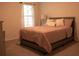 Spacious bedroom with a comfortable bed and neutral color palette at 2496 Osceola Rd, Lithonia, GA 30058