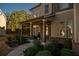 Inviting front porch with seating area, brick columns, and landscaping at 2496 Osceola Rd, Lithonia, GA 30058