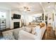 Open living room with fireplace flowing into the dining area and kitchen at 2496 Osceola Rd, Lithonia, GA 30058