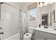 Clean bathroom with shower/tub combo and gray vanity at 2600 Ravencliff Dr # 161, Austell, GA 30168