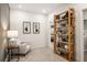 Cozy reading nook with comfy chair, side table, and built-in shelving at 2600 Ravencliff Dr # 161, Austell, GA 30168