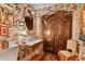 Unique bathroom featuring floral wallpaper, a vintage vanity, and elegant decorative touches at 3532 S Fulton Ave, Hapeville, GA 30354