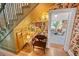 Unique hallway with floral wallpaper, a wooden staircase, and a cozy seating area at 3532 S Fulton Ave, Hapeville, GA 30354