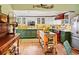 Charming kitchen featuring two-tone cabinets, stainless steel appliances, and an island with storage at 3532 S Fulton Ave, Hapeville, GA 30354