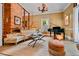 Stylish living room with a fireplace, piano, and elegant furnishings at 3532 S Fulton Ave, Hapeville, GA 30354