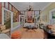 Spacious living room featuring hardwood floors, soft rug, a fireplace, and a piano at 3532 S Fulton Ave, Hapeville, GA 30354