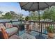 Private patio features comfortable seating area, table, and overhead umbrella at 3532 S Fulton Ave, Hapeville, GA 30354