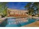 Stunning pool with an outdoor entertaining area and lighting for evening enjoyment at 3532 S Fulton Ave, Hapeville, GA 30354