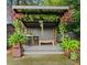 Lush backyard oasis with a pergola and decorative plants at 3532 South Fulton Ave, Hapeville, GA 30354