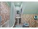 Unique bathroom featuring a bathtub and pedestal sink, adorned with charming tile work at 3532 South Fulton Ave, Hapeville, GA 30354