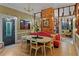 Bright dining area with a unique table and red banquette at 3532 South Fulton Ave, Hapeville, GA 30354